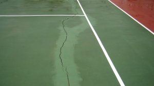 Why Do Tennis Courts Crack Under The Tennis Net?