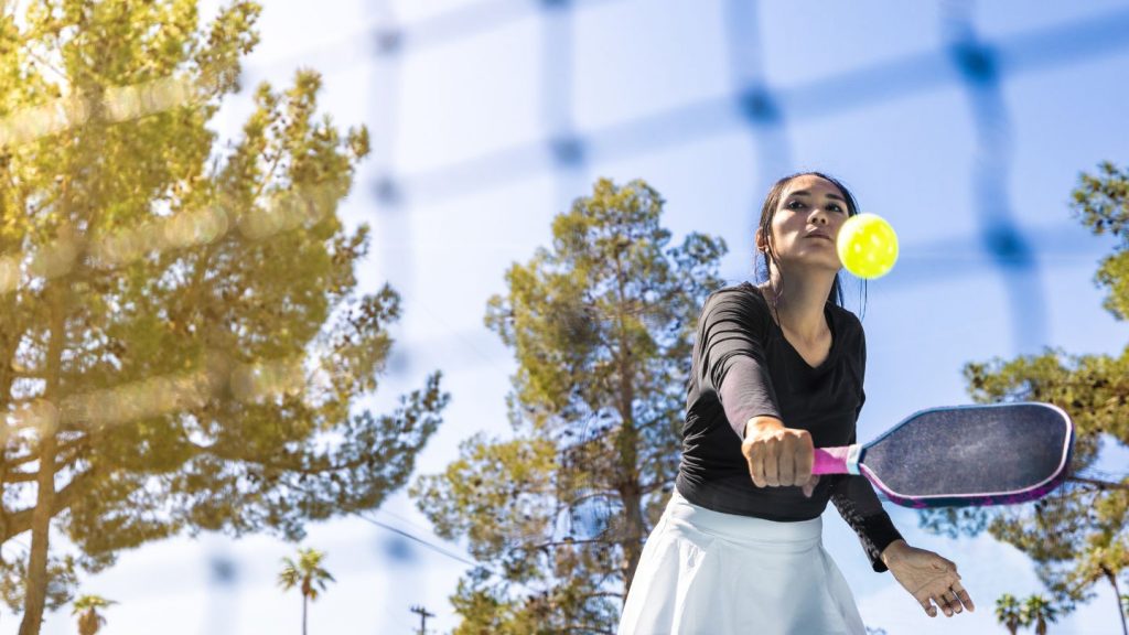 Woman Playing Tennis On Court